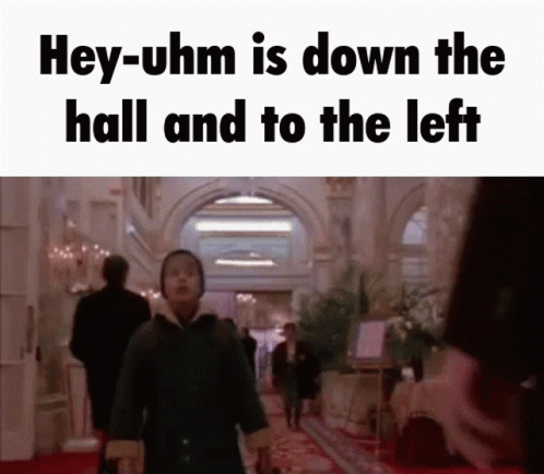 Man Walking Down Hallway Saying Hey-uhm Is Down the Hall and to the Left