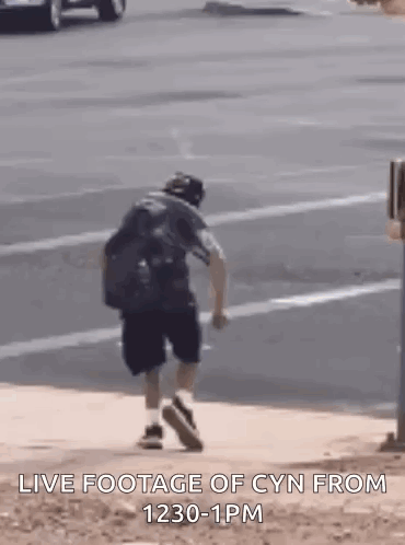 Man Walking Down Sidewalk