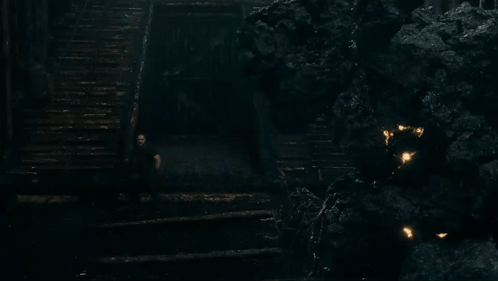Man Walking Down Stairs in Dark