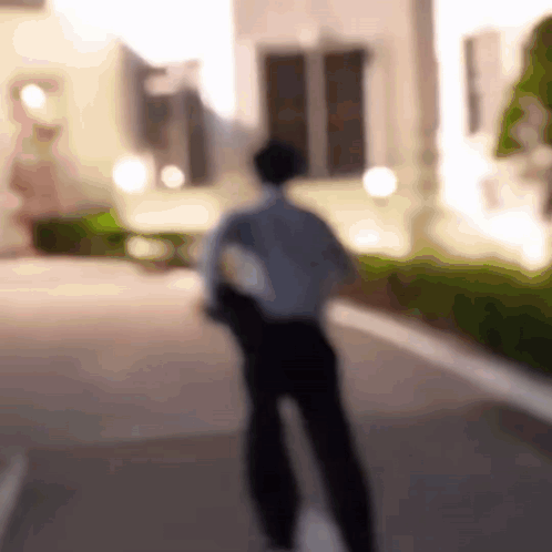 Man Walking Down Street