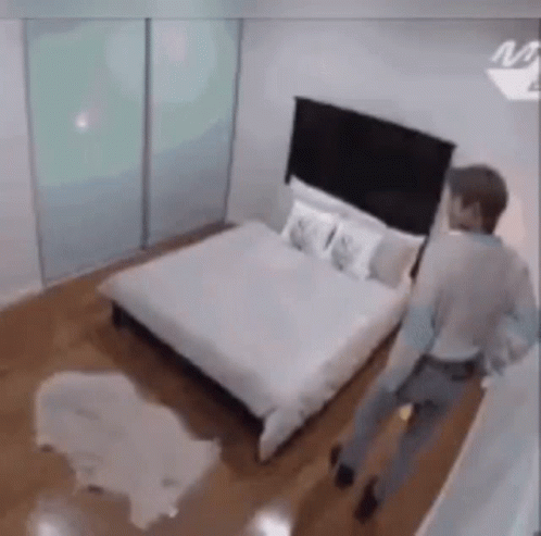 Man Walking In Bedroom GIF