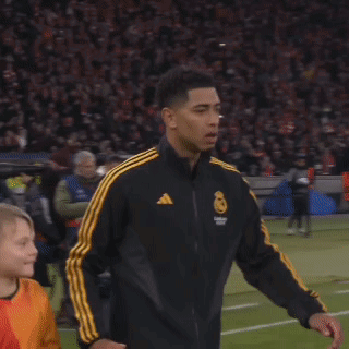 Man Walking In Black And Yellow Striped Jacket GIF