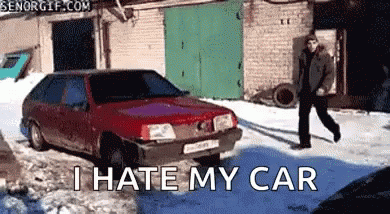 Man Walking in Front of Red Car Saying I Hate My Car
