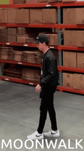 Man Walking In Warehouse Moonwalk GIF