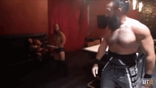 Man Walking In Wrestling Match GIF