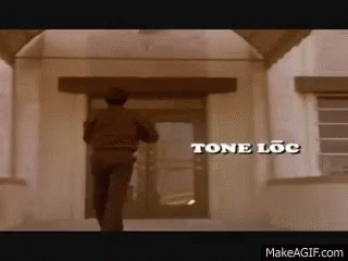 Man Walking Into Tone Loc Building