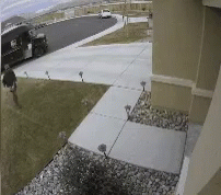 Man Walking Next to Delivery Truck