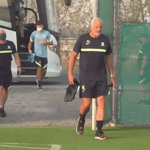 Man Walking on Field in Number 64 Shirt