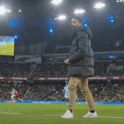 Man Walking On Soccer Field With The Smarter Way To Pay Sign GIF