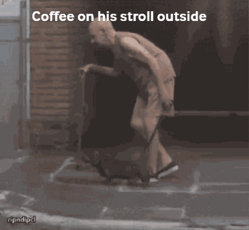 Man Walking Outside With Coffee