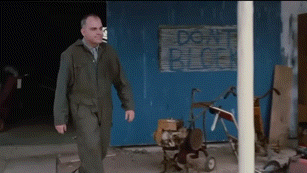 Man Walking Past Don't Block Sign GIF