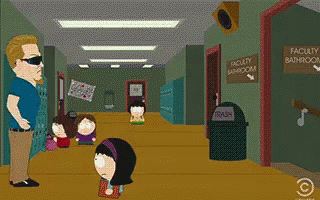 Man Walking Past Faculty Bathroom Sign GIF