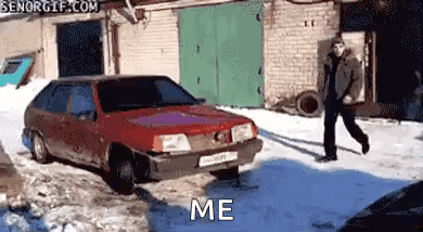 Man Walking Past Red Car Saying Me