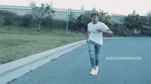 Man Walking Street With Worldstarhiphop.com GIF