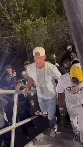Man Walking Through Crowd Wave Check
