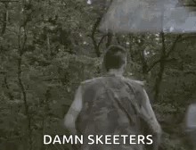Man Walking Through Forest With Umbrella Saying Damn Skeeeters