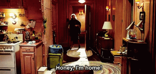 Man Walking Through Kitchen Saying Honey I'm Home