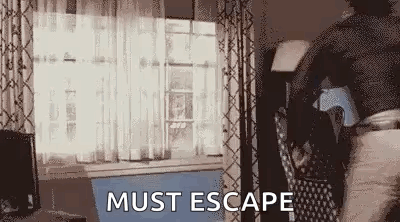 Man Walking Through Living Room Saying Must Escape GIF