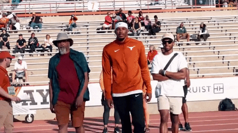 Man Walking Wearing Hook Em Jacket GIF