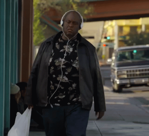 Man Walking With Headphones