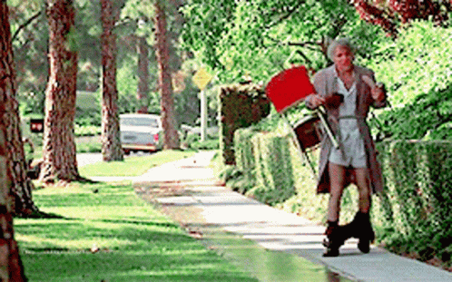 Man Walking with Red Flag