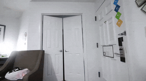 Man Walks Inside Room In Red Adidas Suit GIF