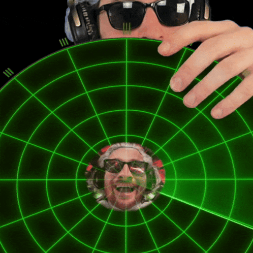 Man Watching Green Radar With Sunglasses and Headphones