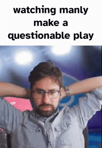 Man Watching Questionable Play Hands Behind Head