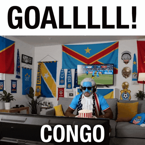 Man Watching Soccer on Couch Saying Congo