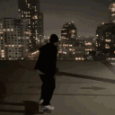 Man Watching Sparkling City Lights GIF