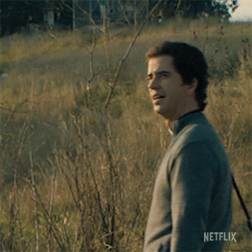 Man Waving in Field With Morning Netflix