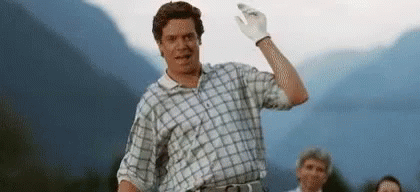 Man Waving In Plaid Shirt And White Glove GIF