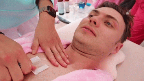 Man Wax And Pull Hair On Chest GIF