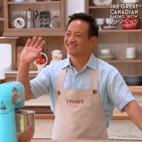 Man Wearing Apron Saying Vincent Waves Hand
