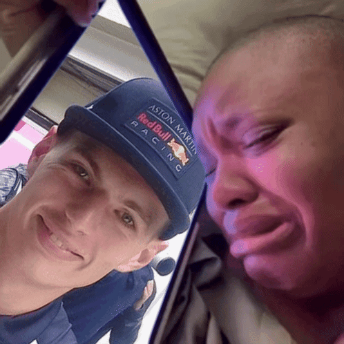 Man Wearing Aston Martin Red Bull Racing Hat Smiling