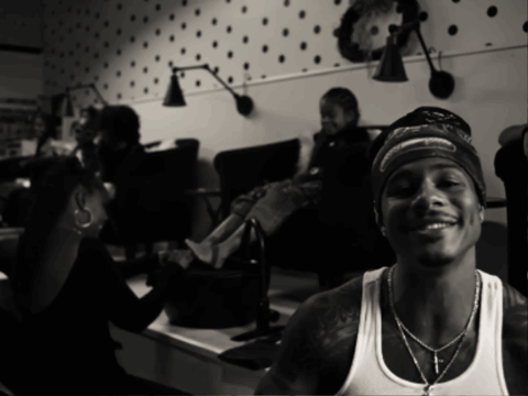 Man Wearing Bandana and White Tank Top Smiling