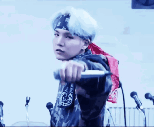 Man Wearing Bandana Holding Microphone