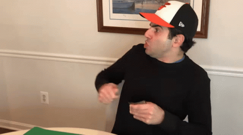 Man Wearing Baseball Cap with L