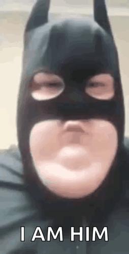 Man Wearing Batman Mask Making Face