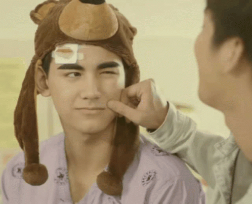 Man Wearing Bear Hat With Bandage on Head