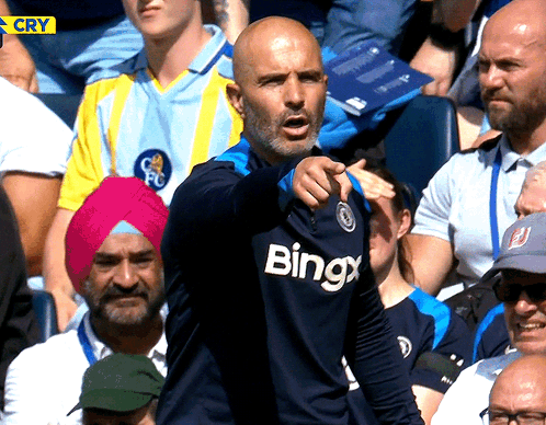 Man Wearing Bingx Shirt Pointing GIF