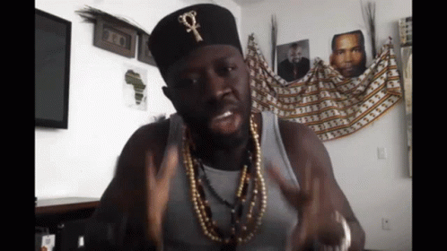 Man Wearing Black Cross Hat GIF
