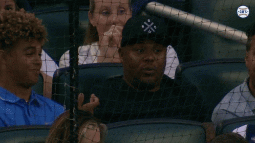 Man Wearing Black Cross Hat GIF