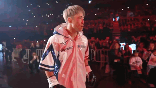 Man Wearing Boxing Gloves And Docomo Jacket GIF