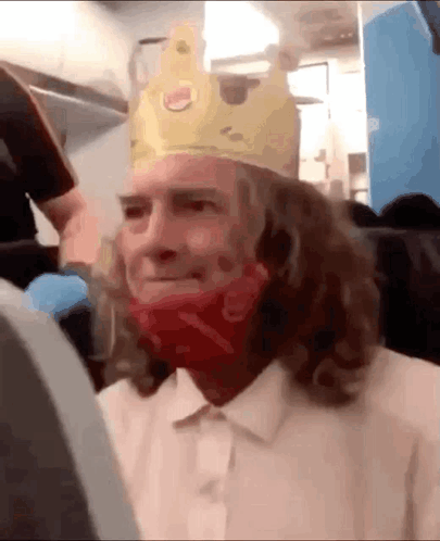 Man Wearing Burger King Crown and Red Bandana