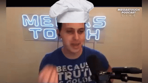 Man Wearing Chef Hat and Cold Truth Shirt
