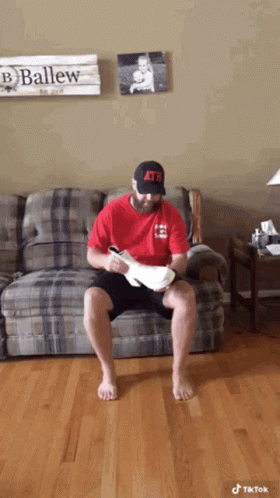 Man Wearing Coat With Uga Logo GIF