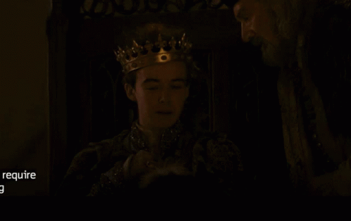 Man Wearing Crown Talking to Another Man
