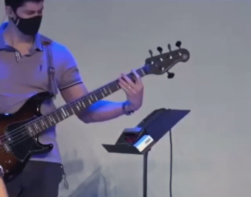 Man Wearing Face Mask Playing Guitar GIF