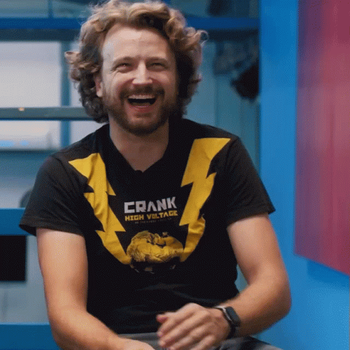 Man Wearing Frank High Voltage T-Shirt Laughs